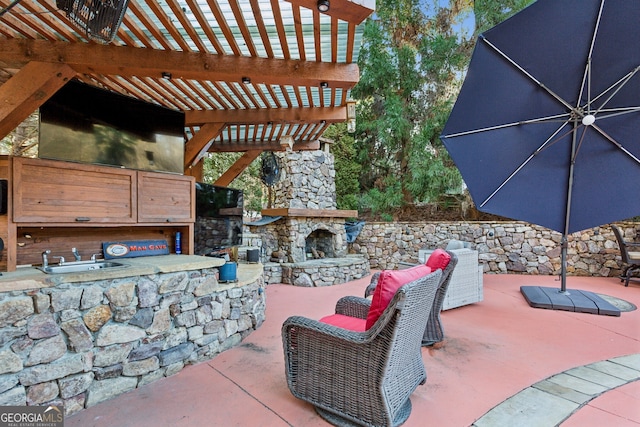 view of patio featuring an outdoor living space with a fireplace, exterior bar, and a pergola