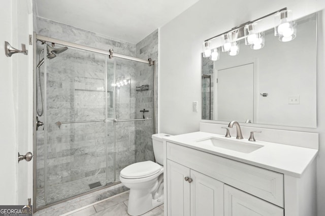 full bath with a stall shower, marble finish floor, vanity, and toilet