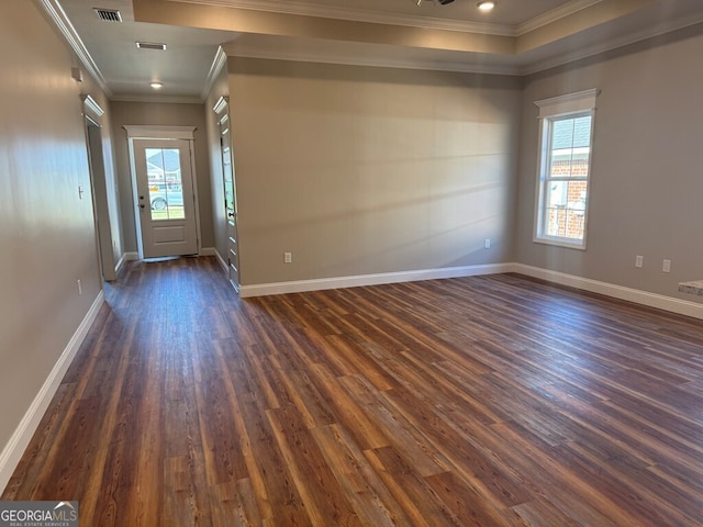 foyer entrance with crown molding and dark wood-type flooring