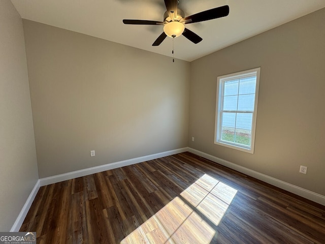 unfurnished room featuring ceiling fan and dark hardwood / wood-style flooring