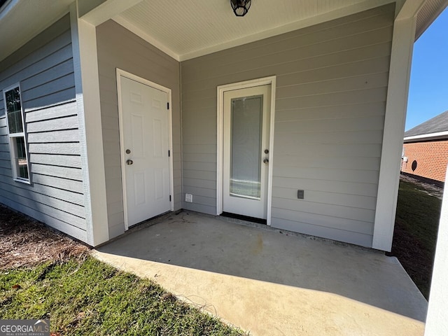 doorway to property featuring a patio area