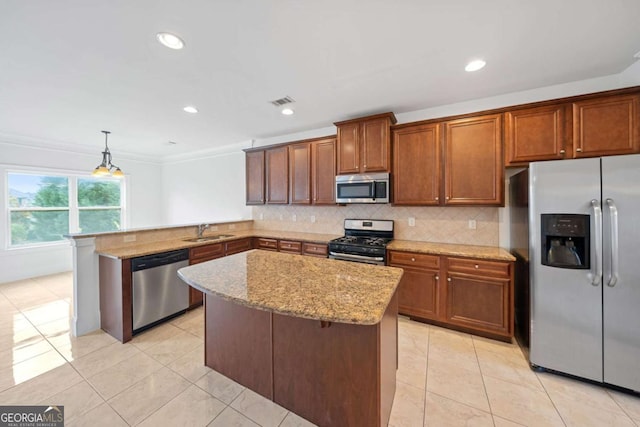 kitchen featuring sink, stainless steel appliances, kitchen peninsula, crown molding, and pendant lighting