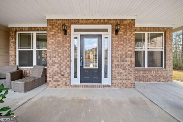 doorway to property featuring covered porch