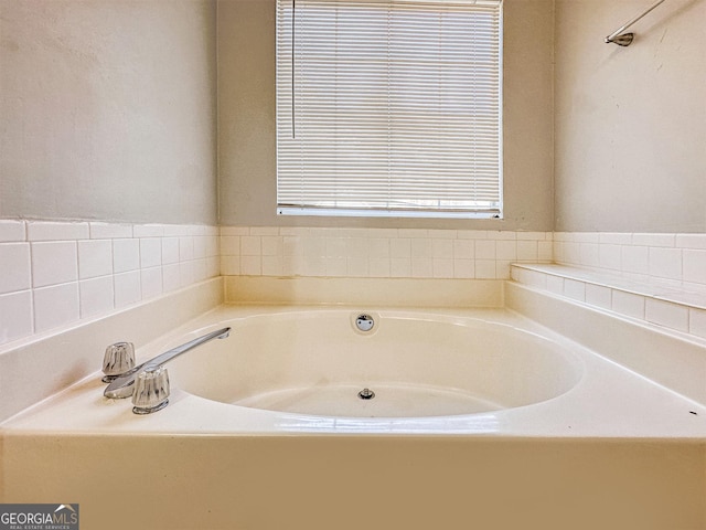 bathroom with a tub