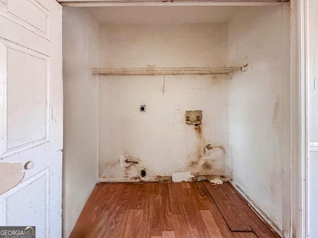 laundry room with hookup for a washing machine, electric dryer hookup, and wood-type flooring