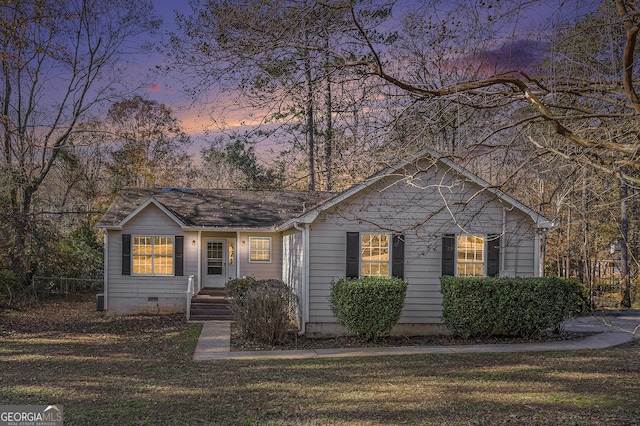 ranch-style house featuring a yard