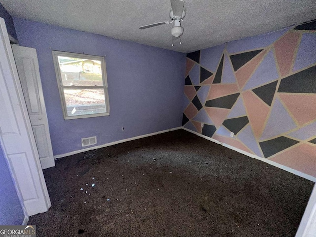 unfurnished bedroom featuring ceiling fan, carpet floors, and a textured ceiling