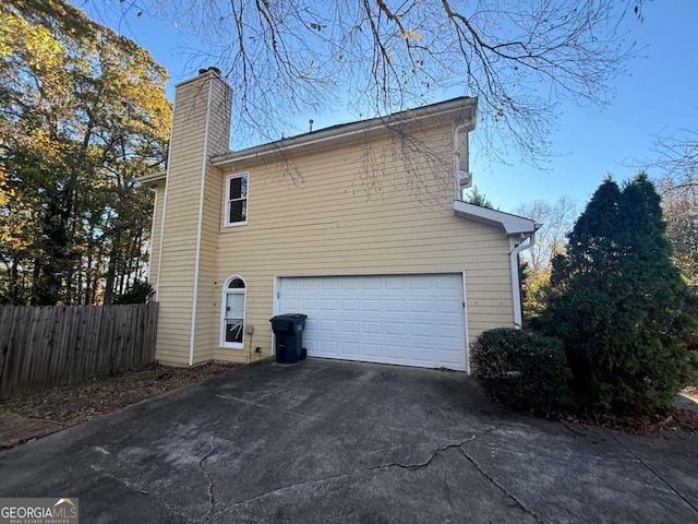 view of side of property featuring a garage