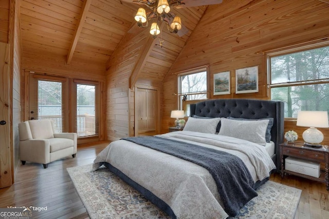 236 William Branch Rd, Morganton, GA 30560 - bedroom featuring hardwood / wood-style flooring, wood walls, multiple windows, and vaulted ceiling