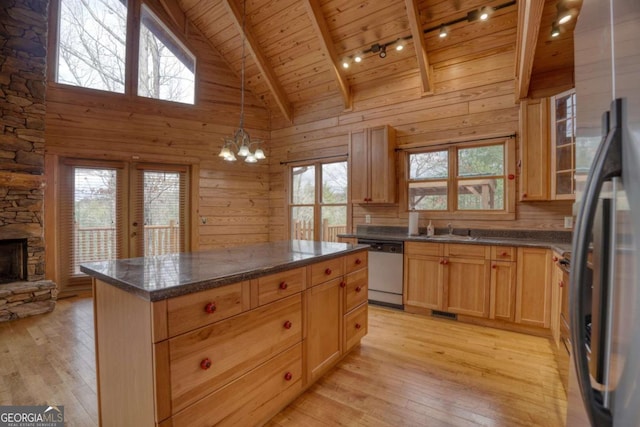 kitchen featuring wood ceiling, high vaulted ceiling, light hardwood / wood-style floors, and appliances with stainless steel finishes