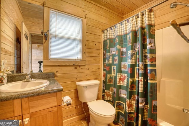 full bathroom featuring wood walls, vanity, wood ceiling, and toilet