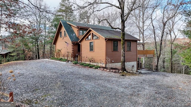 236 William Branch Rd, Morganton, GA 30560 - view of side of property with stone siding, roof with shingles, and gravel driveway