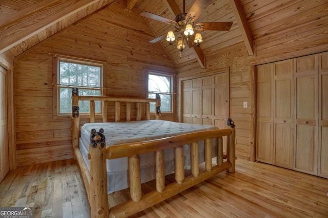 236 William Branch Rd, Morganton, GA 30560 - bedroom featuring lofted ceiling with beams, wood ceiling, multiple closets, and wood walls