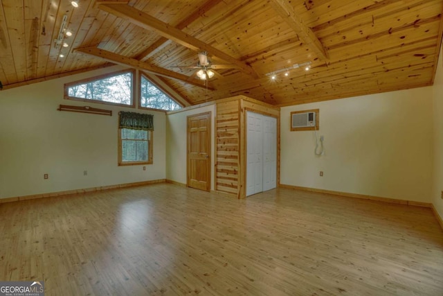 interior space featuring ceiling fan, vaulted ceiling with beams, a wall unit AC, wood ceiling, and light wood-type flooring