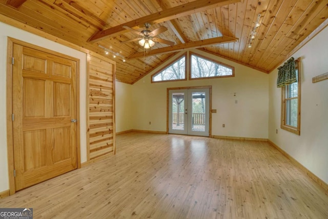 unfurnished living room featuring french doors, ceiling fan, light hardwood / wood-style floors, beam ceiling, and wood ceiling