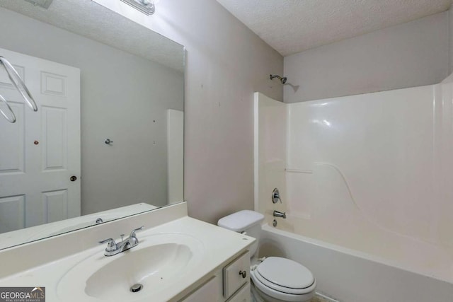 full bathroom with vanity, toilet, shower / tub combination, and a textured ceiling