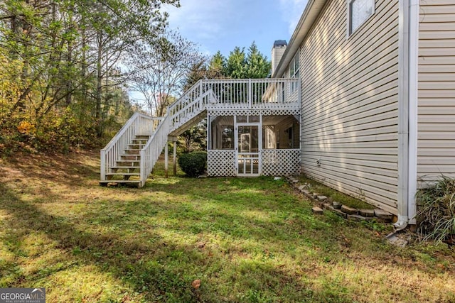 view of yard featuring a sunroom