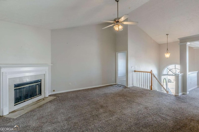 unfurnished living room with carpet, high vaulted ceiling, and ceiling fan