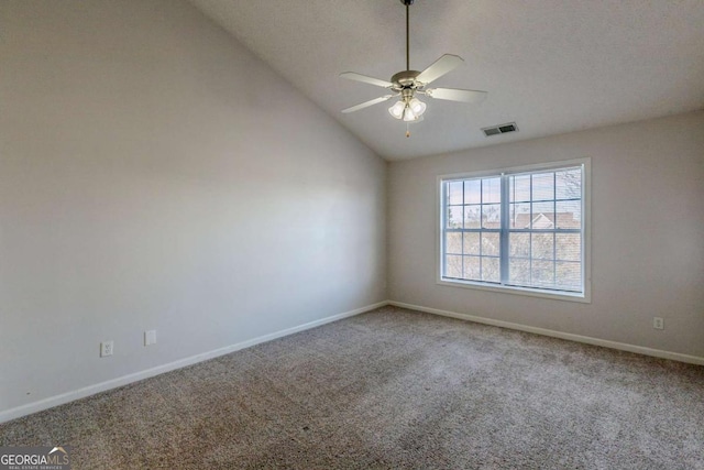 unfurnished room with carpet flooring, ceiling fan, and vaulted ceiling