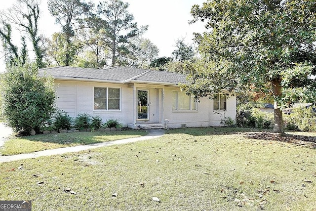 single story home with a front yard