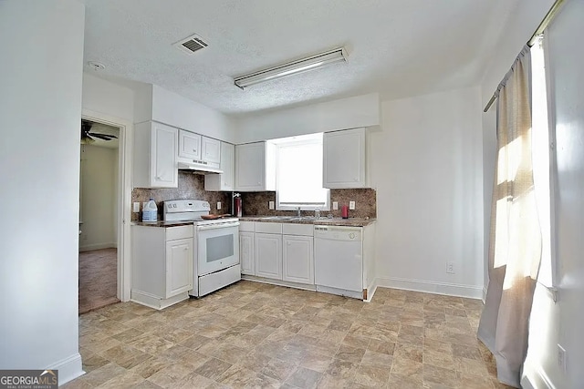 kitchen featuring white cabinetry, sink, tasteful backsplash, a textured ceiling, and white appliances