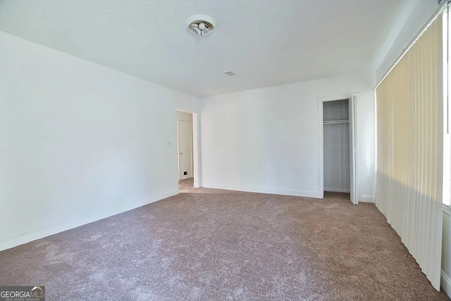 unfurnished bedroom with carpet