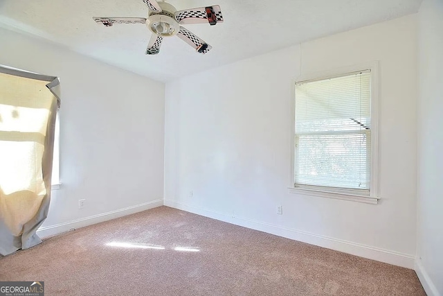 spare room with carpet flooring and ceiling fan