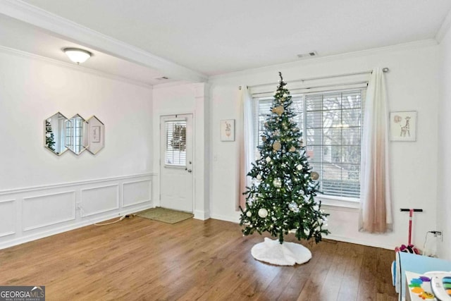 entryway with a healthy amount of sunlight and hardwood / wood-style flooring