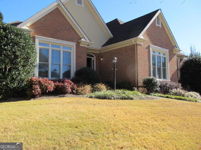 view of front of home with a front yard