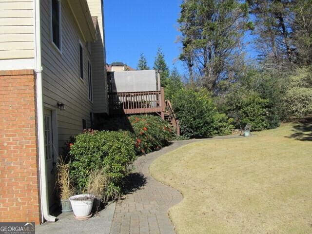 view of yard with a wooden deck