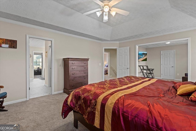 carpeted bedroom featuring a textured ceiling, ceiling fan, and crown molding