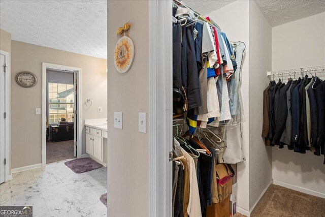 bathroom featuring vanity and a textured ceiling