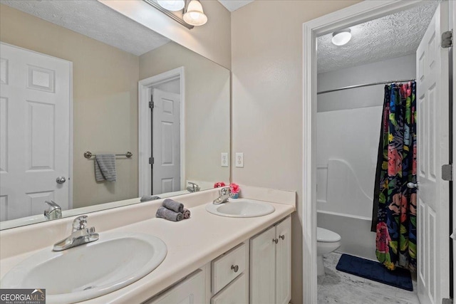 full bathroom featuring vanity, a textured ceiling, toilet, and shower / tub combo with curtain