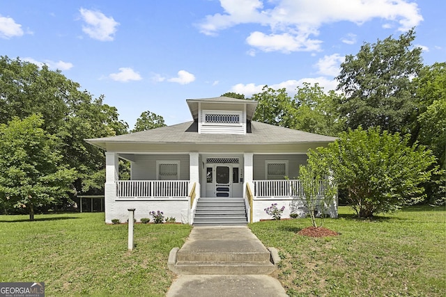 bungalow-style house featuring a porch and a front yard