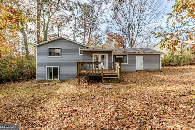 rear view of house with a wooden deck