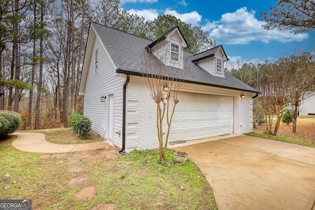 view of side of home with a garage