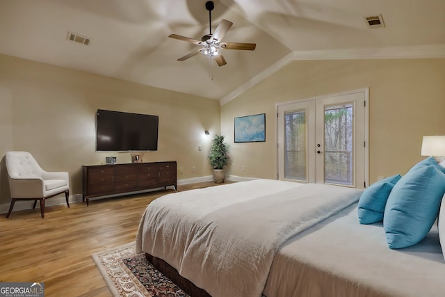 bedroom featuring access to outside, french doors, vaulted ceiling, ceiling fan, and light wood-type flooring