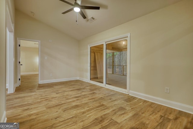 spare room with high vaulted ceiling, light hardwood / wood-style flooring, and ceiling fan