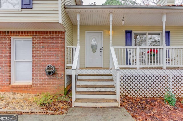 doorway to property with covered porch