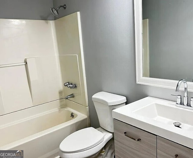 full bathroom featuring vanity,  shower combination, and toilet