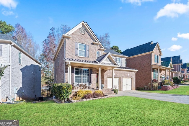 view of front of property with a porch, a garage, and a front lawn