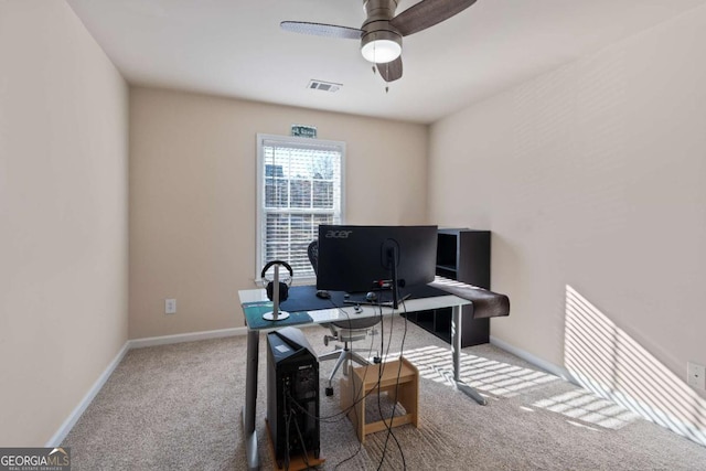 office space with carpet floors and ceiling fan