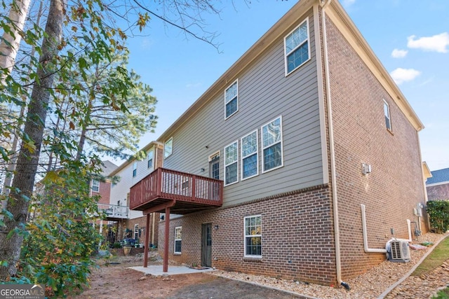 rear view of house with a patio and a deck