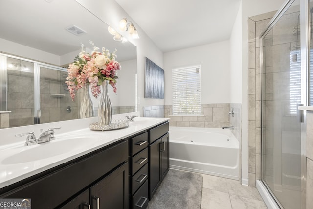 bathroom with tile patterned floors, vanity, and plus walk in shower