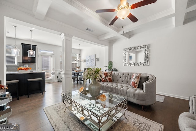 living room featuring dark hardwood / wood-style floors, crown molding, ceiling fan with notable chandelier, and coffered ceiling