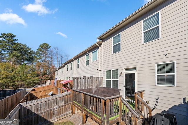 back of house featuring a deck