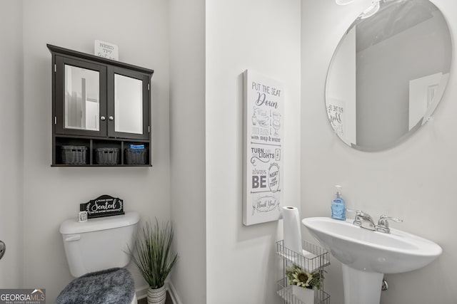 bathroom with toilet and sink