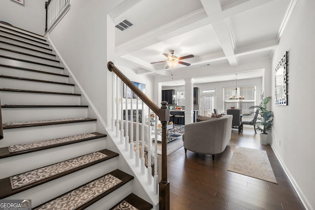 stairs with beamed ceiling, hardwood / wood-style flooring, ornate columns, and coffered ceiling