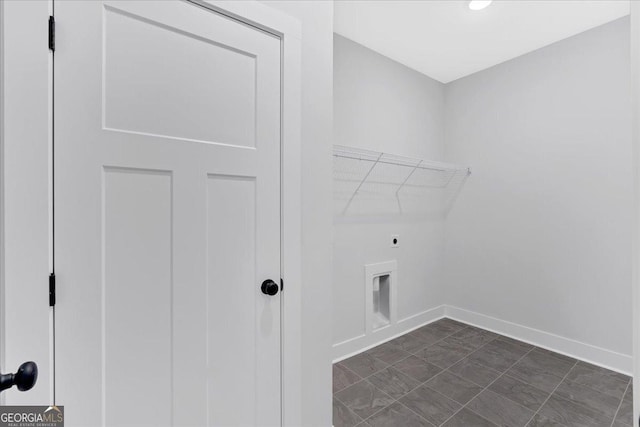 washroom with hookup for an electric dryer