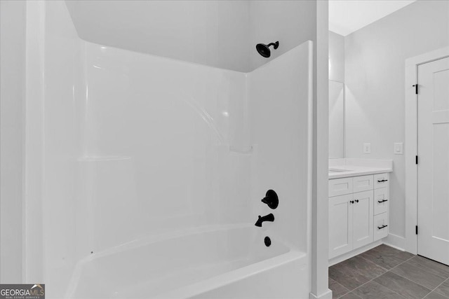 bathroom with vanity and  shower combination